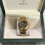 ساعت مچی رولکس دیتونا مردانه طلایی صفحه مشکی Rolex Daytona 255970