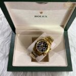 ساعت مچی رولکس دیتونا مردانه طلایی صفحه مشکی Rolex Daytona 255970